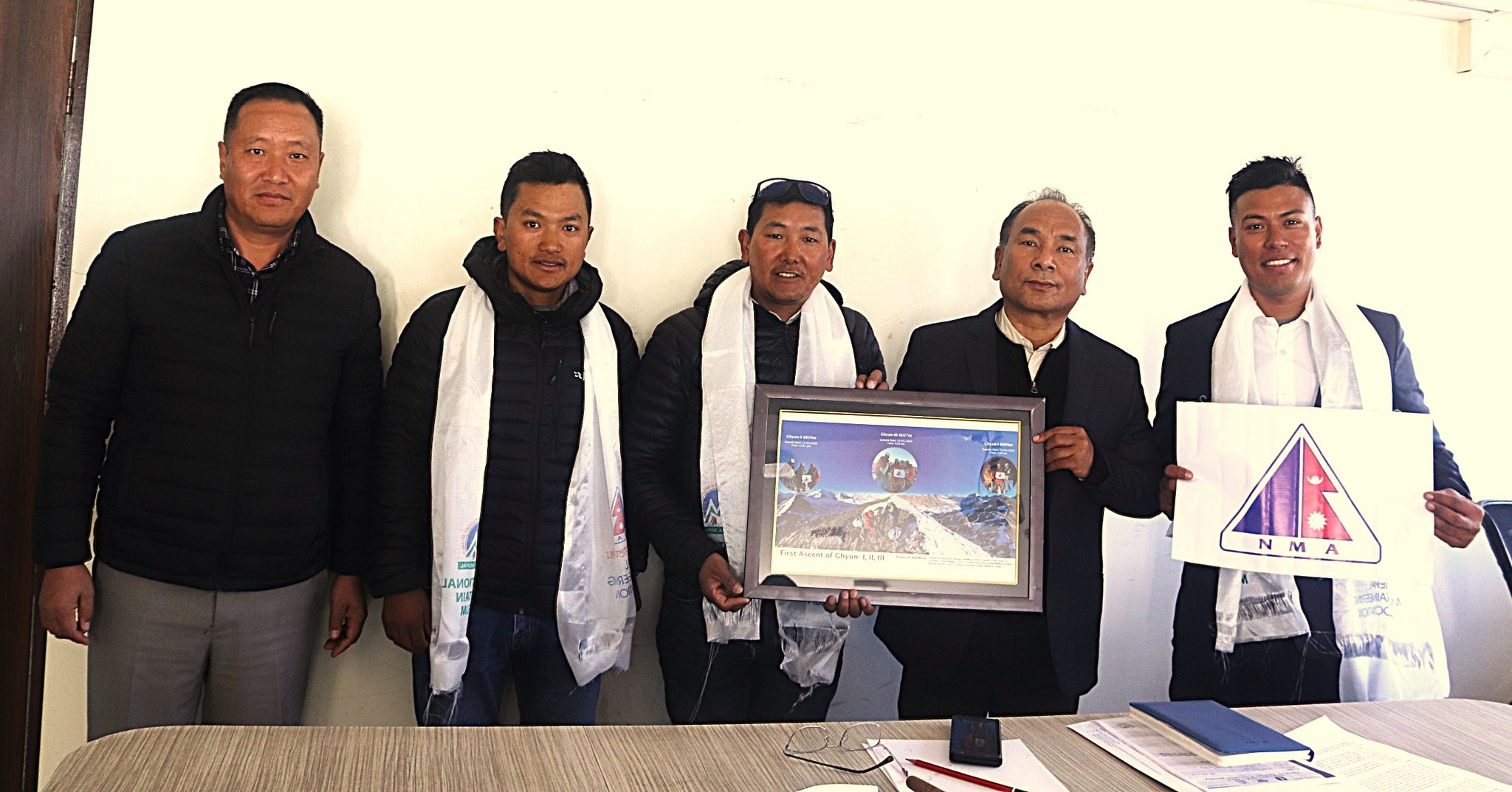 Historic Ghyun Himal expedition team hands over summit photographs, NMA flag
